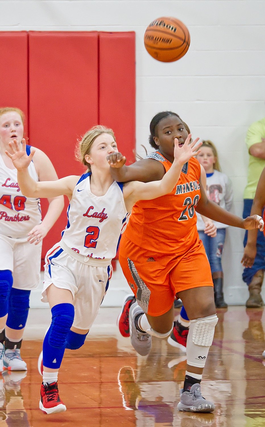 Freshman of the Year Cacie Lennon, 2, and first team all-district honoree Tiara Stephens, 20, battle for a loose ball.